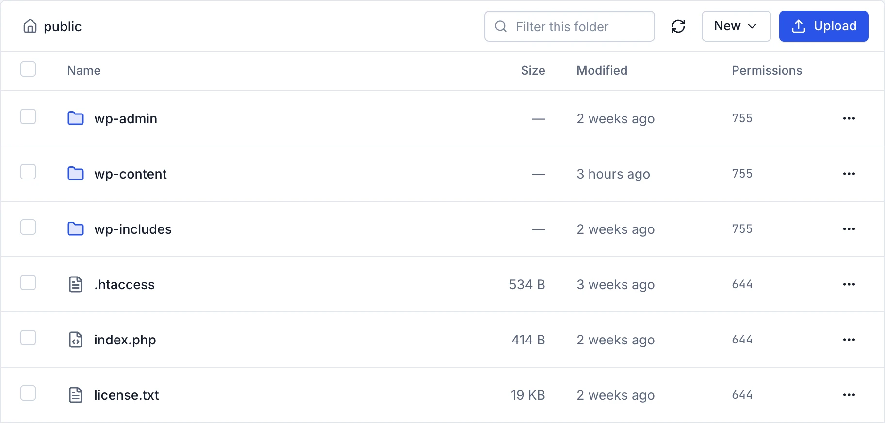 The file manager listing a WordPress site's files, with upload and new-file actions.